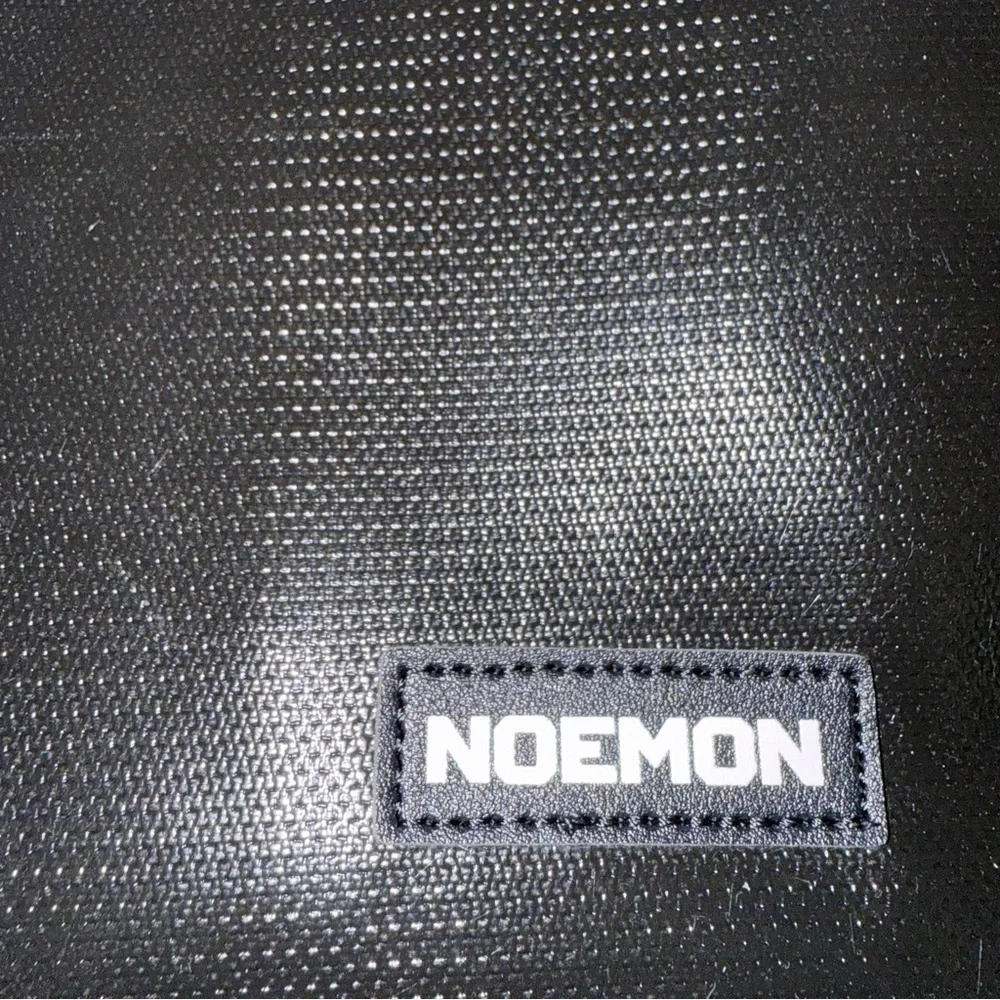 Noemon Black Briefcase Bag – New, 25 Pockets, Never Used
